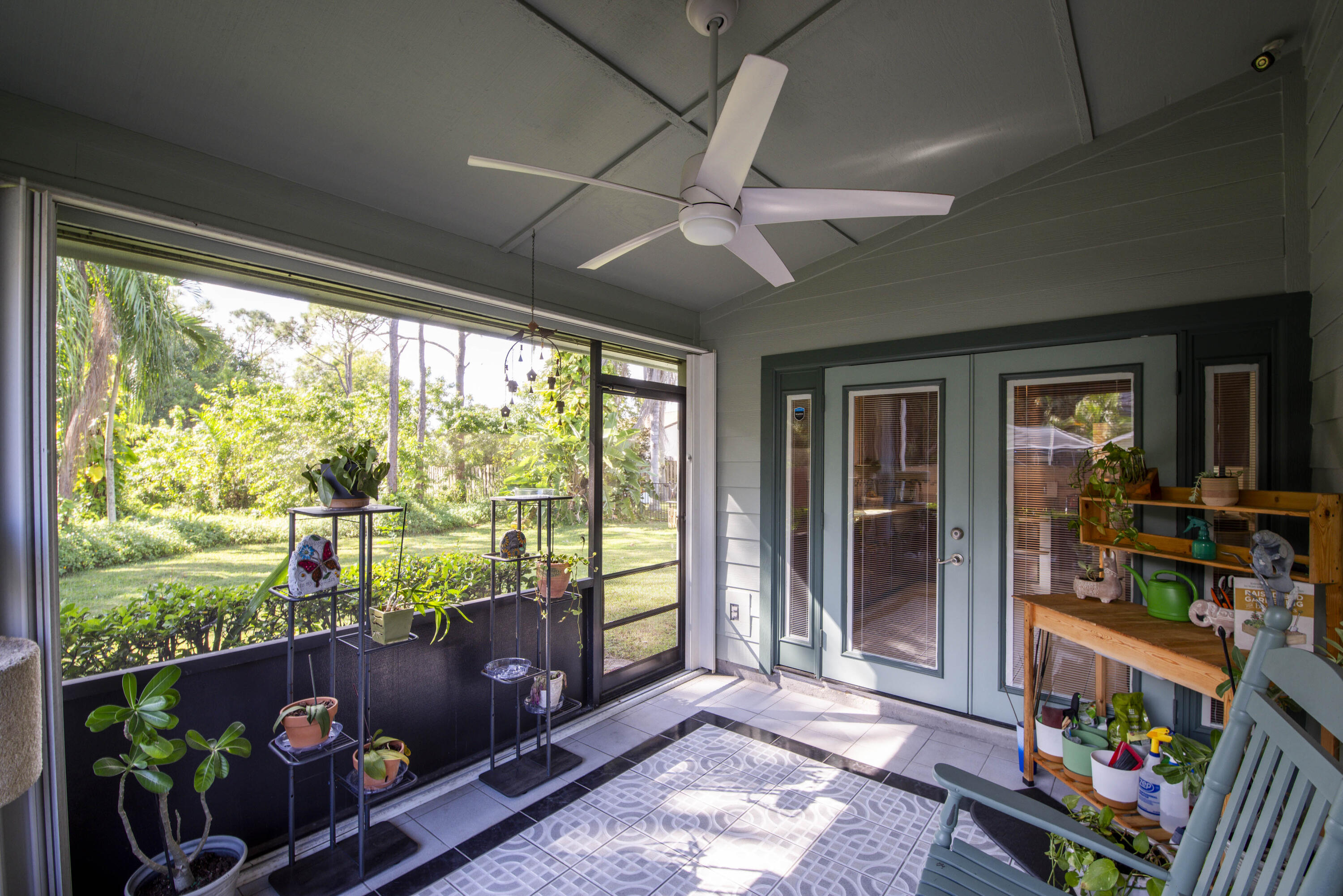 6690 Southeast Raintree Avenue Stuart, FL 34997 - Photo 26 of 43 a room with furniture and a floor to ceiling window