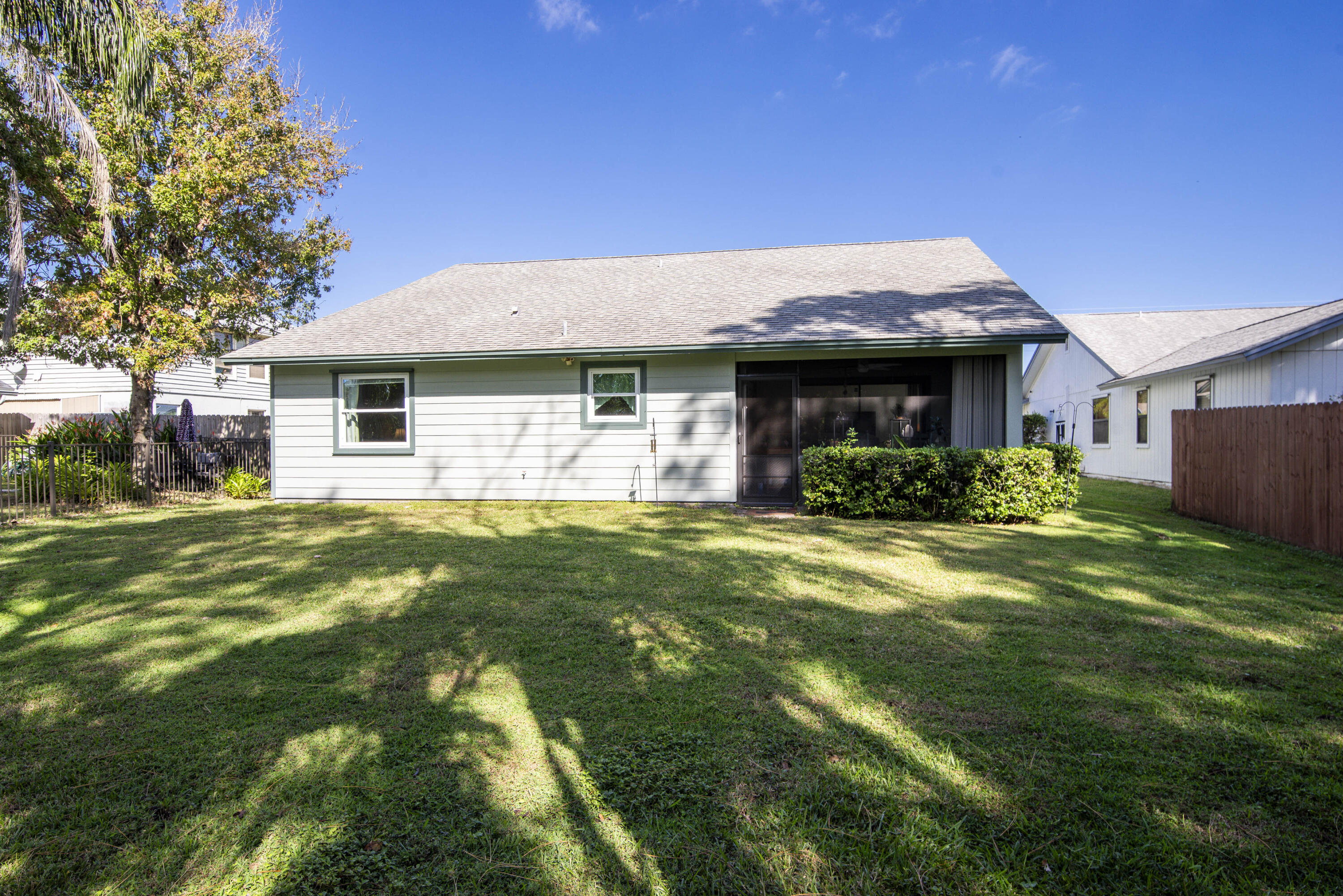 6690 Southeast Raintree Avenue Stuart, FL 34997 - Photo 31 of 43 a front view of a house with garden
