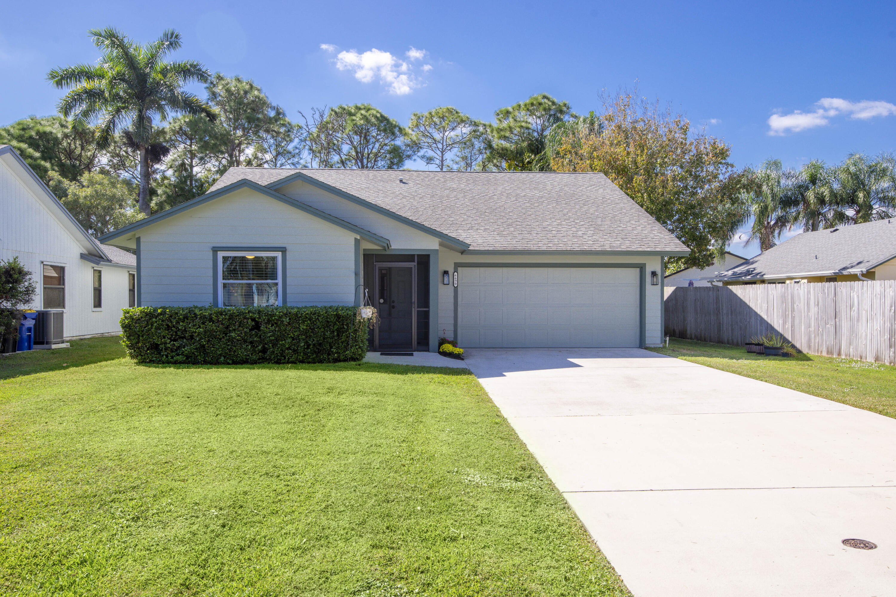 6690 Southeast Raintree Avenue Stuart, FL 34997 - Photo 33 of 43 a house view with a garden space