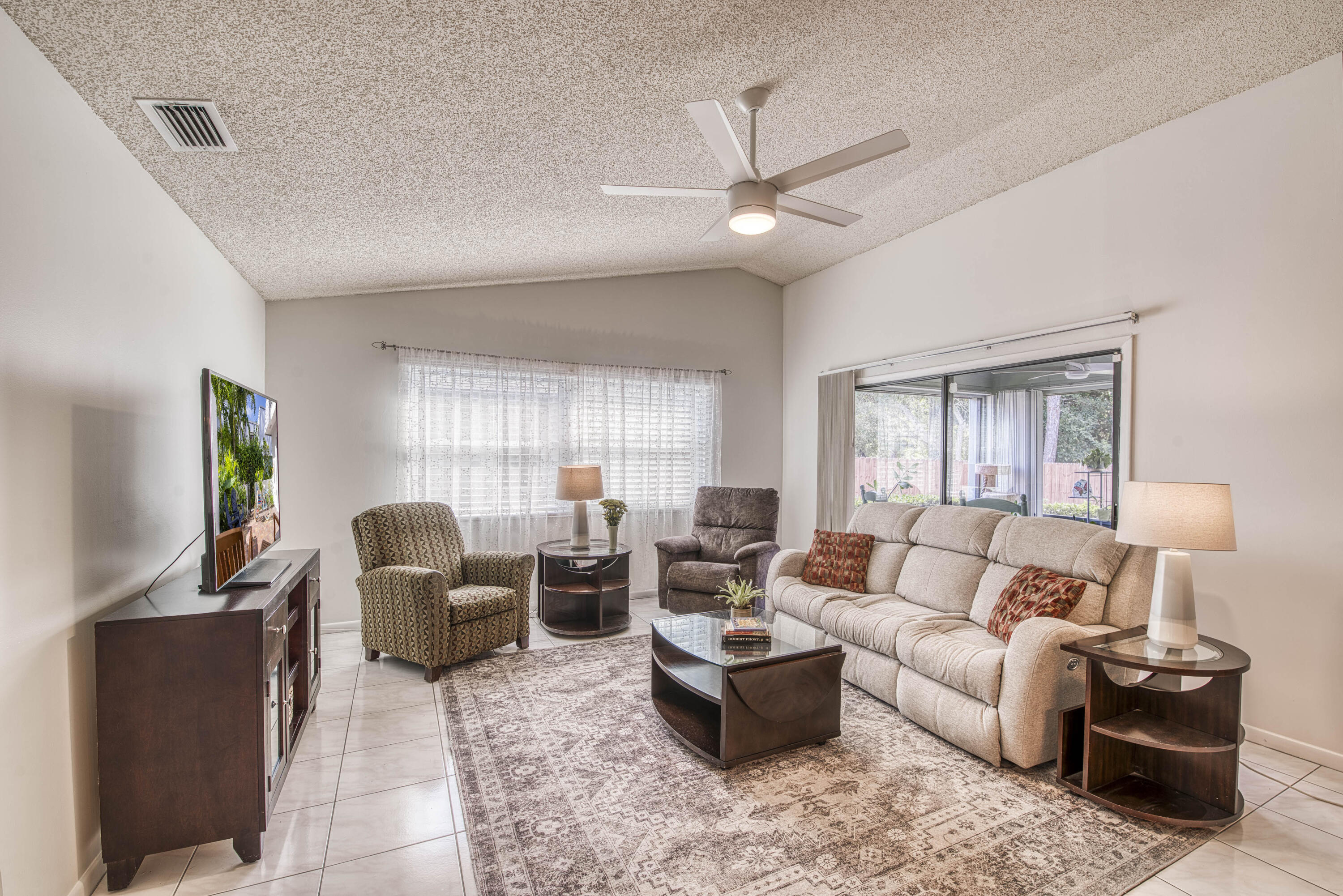 6690 Southeast Raintree Avenue Stuart, FL 34997 - Photo 4 of 43 a living room with furniture and a window