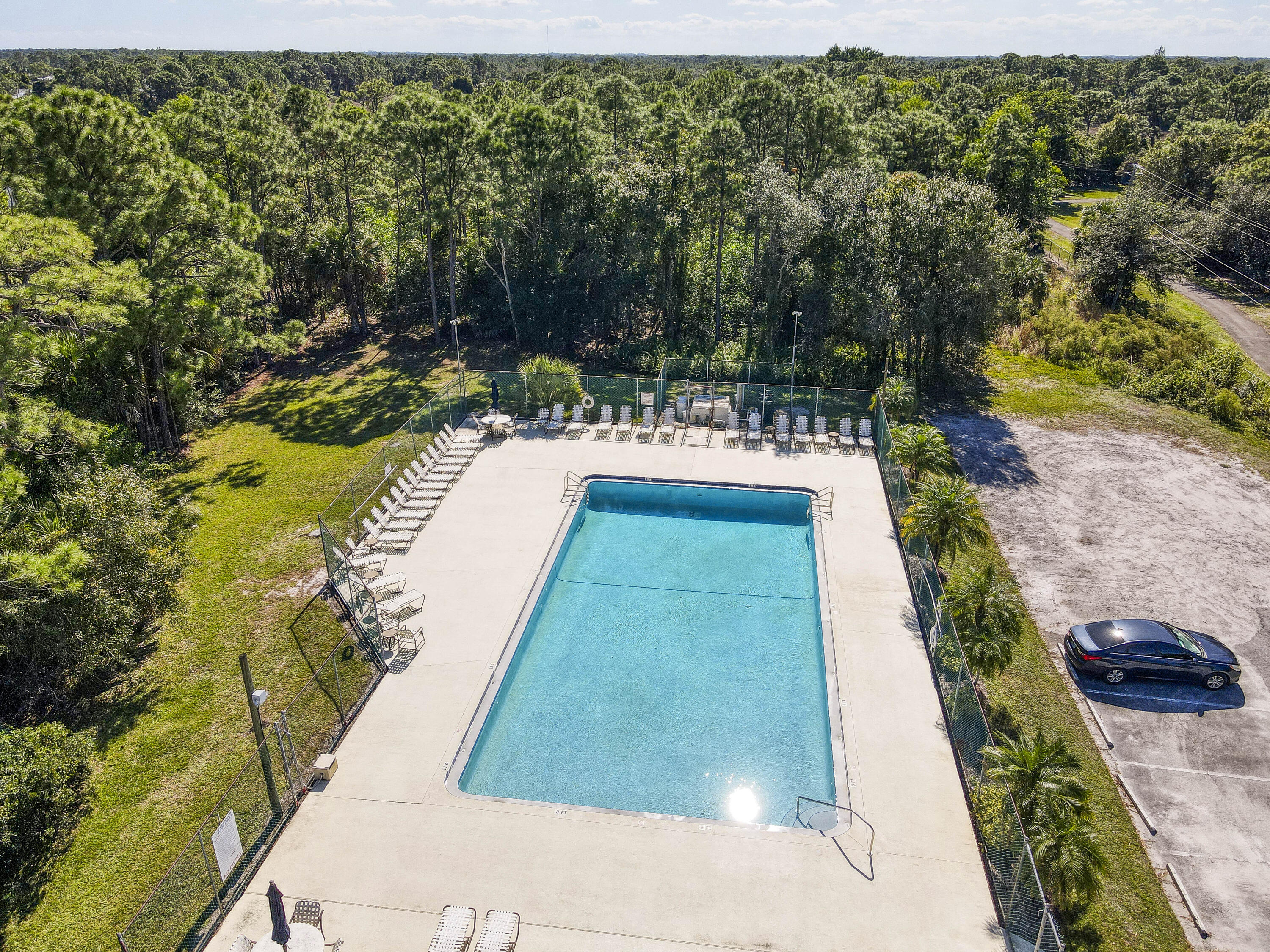 6690 Southeast Raintree Avenue Stuart, FL 34997 - Photo 41 of 43 a view of swimming pool with a patio