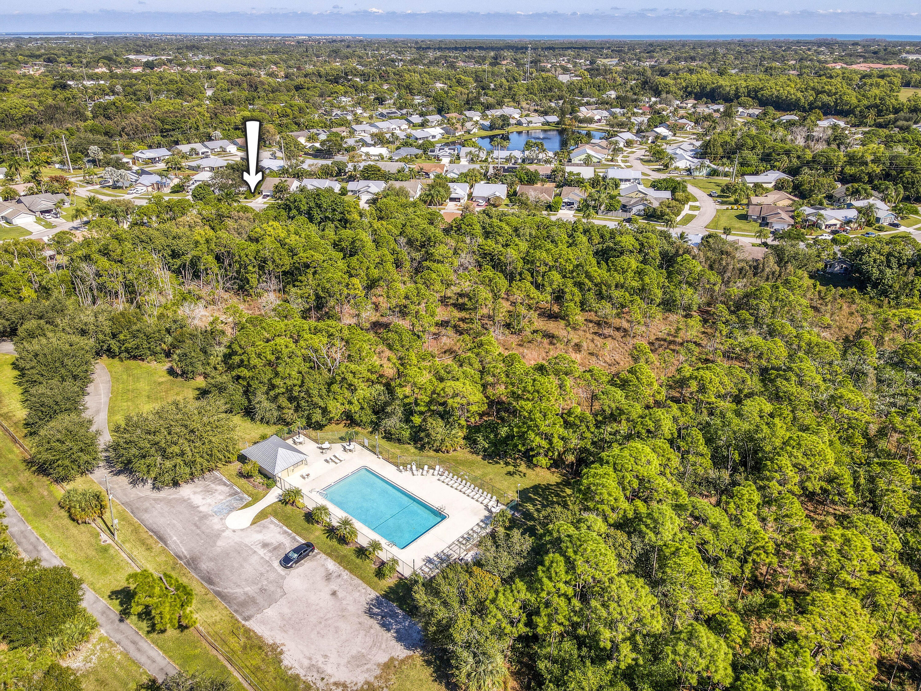 6690 Southeast Raintree Avenue Stuart, FL 34997 - Photo 42 of 43 a view of a yard with an outdoor space