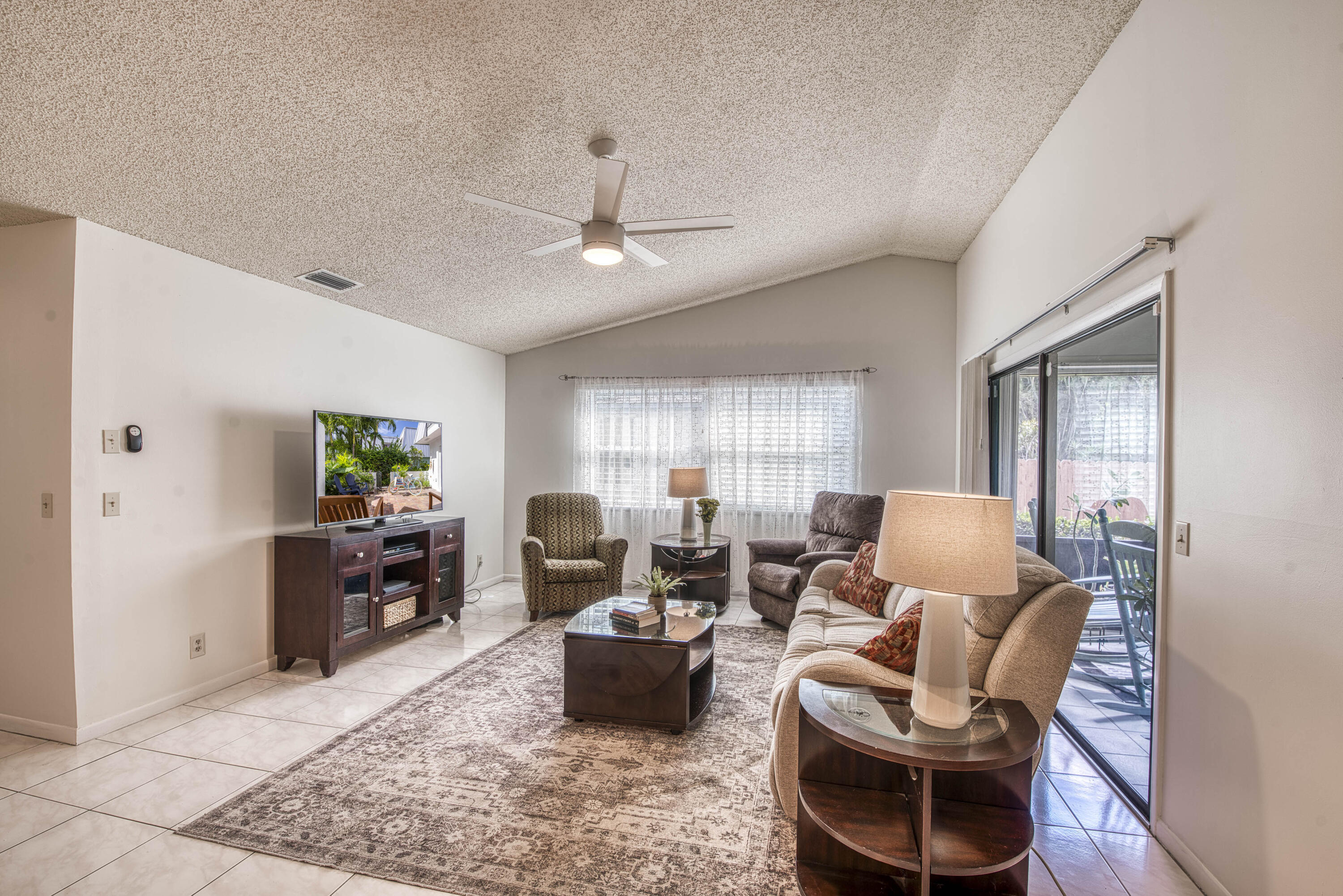 6690 Southeast Raintree Avenue Stuart, FL 34997 - Photo 5 of 43 a living room with furniture or couch and a window
