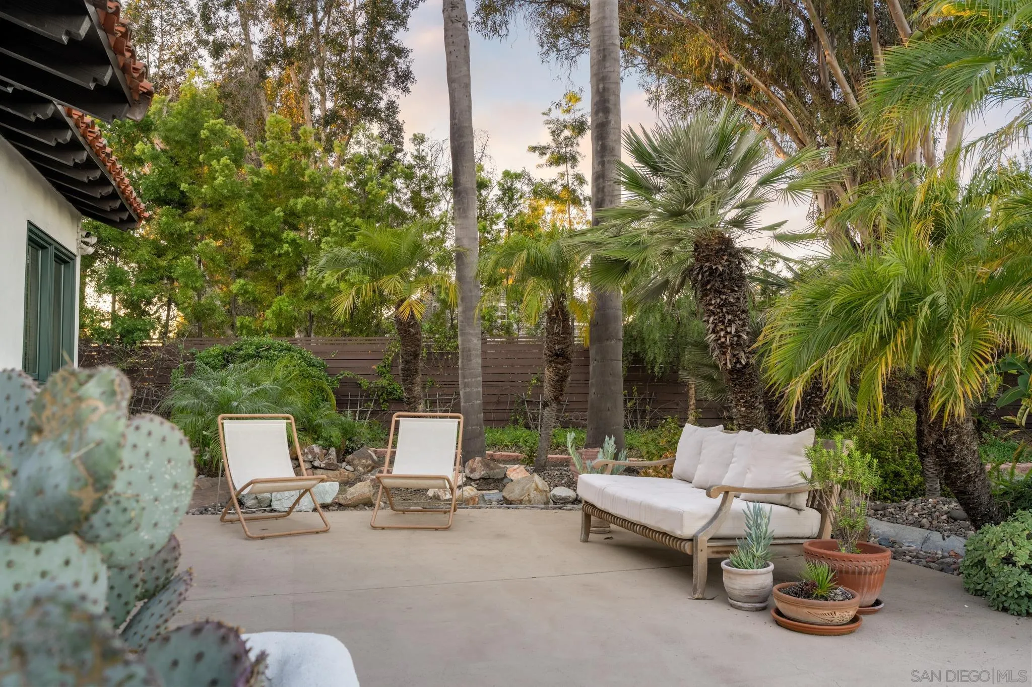 3028 Paseo Cielo Rancho Santa Fe, CA 92024 - Photo 41 of 50 a view of a patio with couches and a fire pit and a large tree