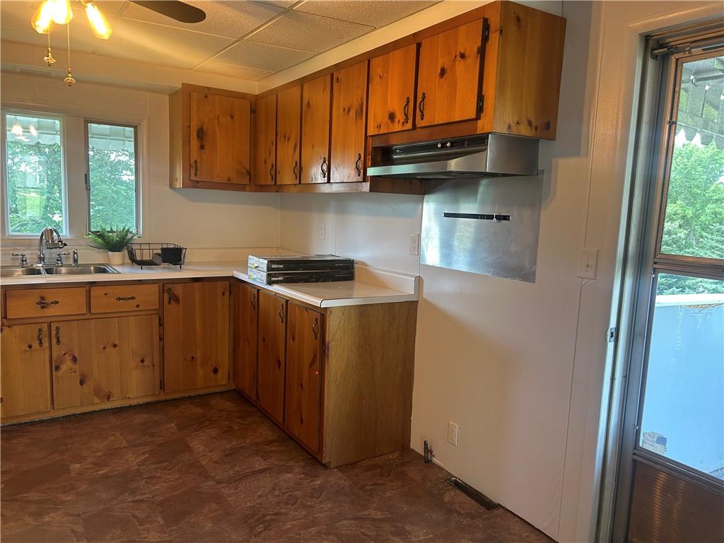618 Patterson Road Apollo, PA 15613 - Photo 10 of 36 a kitchen with stainless steel appliances granite countertop a refrigerator a sink a stove a microwave and cabinets