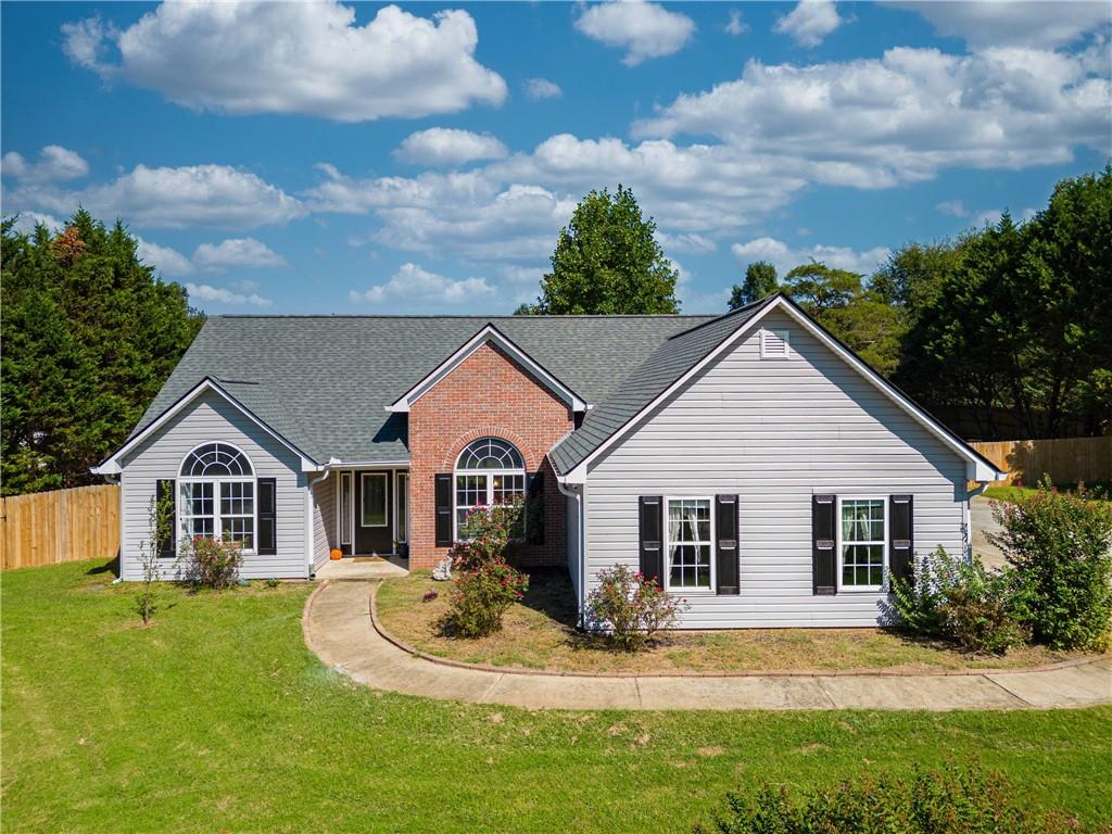 a view of a house with a yard