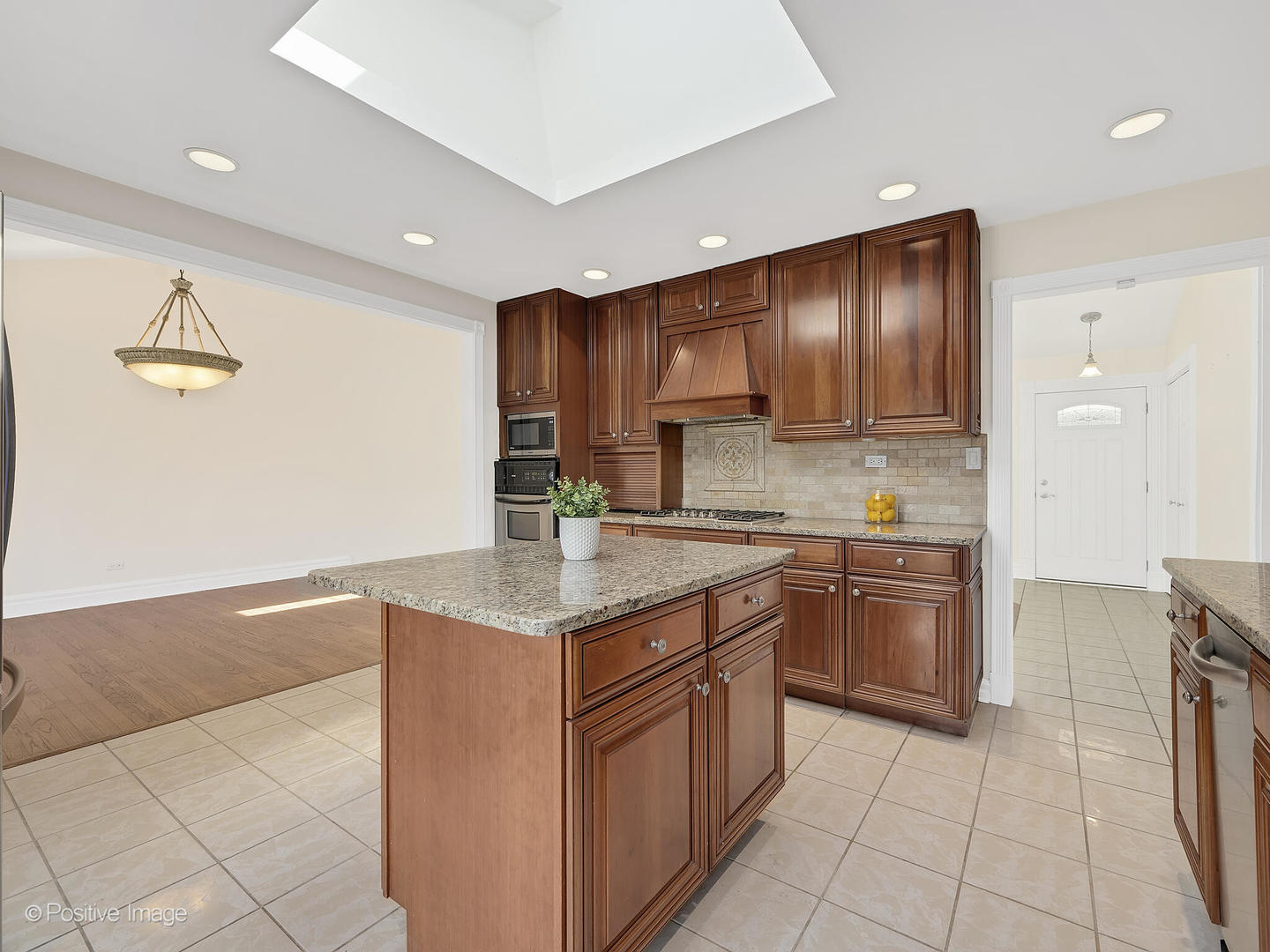 11S568 Book Road Naperville, IL 60564 - Photo 11 of 25 a kitchen with stainless steel appliances granite countertop a sink and cabinets