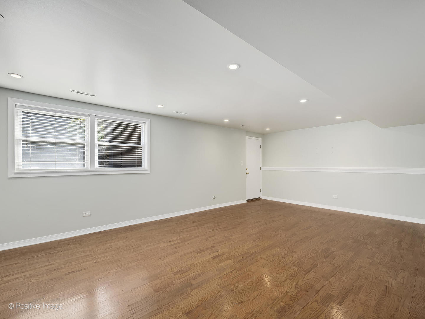 11S568 Book Road Naperville, IL 60564 - Photo 17 of 25 a view of empty room with wooden floor and fan