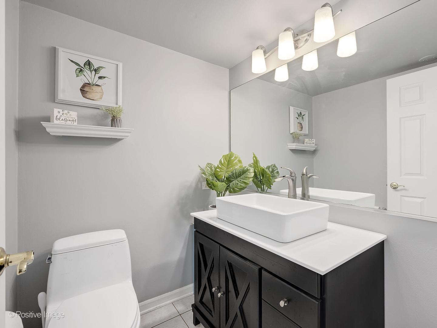 11S568 Book Road Naperville, IL 60564 - Photo 18 of 25 a bathroom with a sink vanity and a toilet