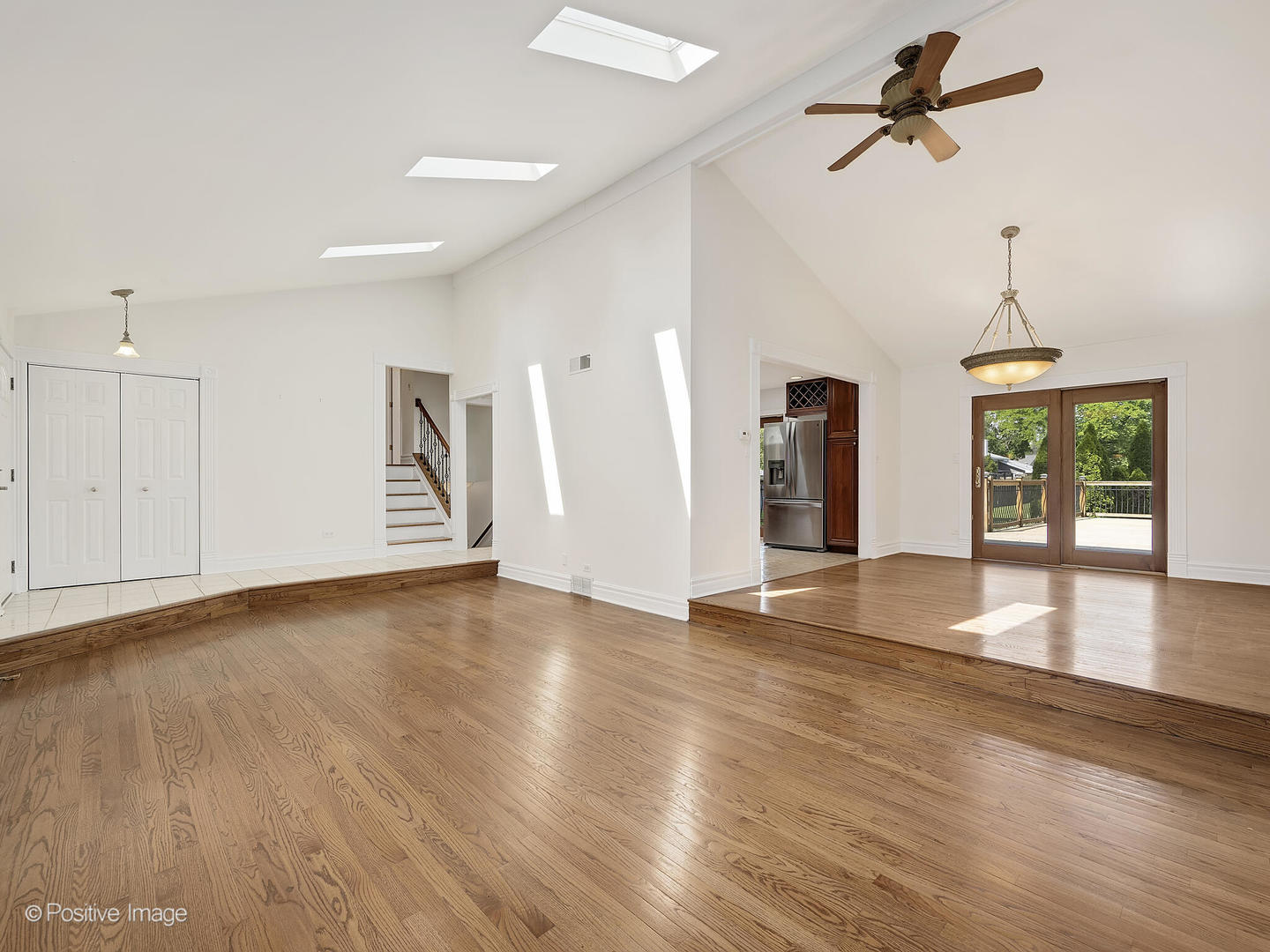 11S568 Book Road Naperville, IL 60564 - Photo 6 of 25 a view of empty room with wooden floor and ceiling fan