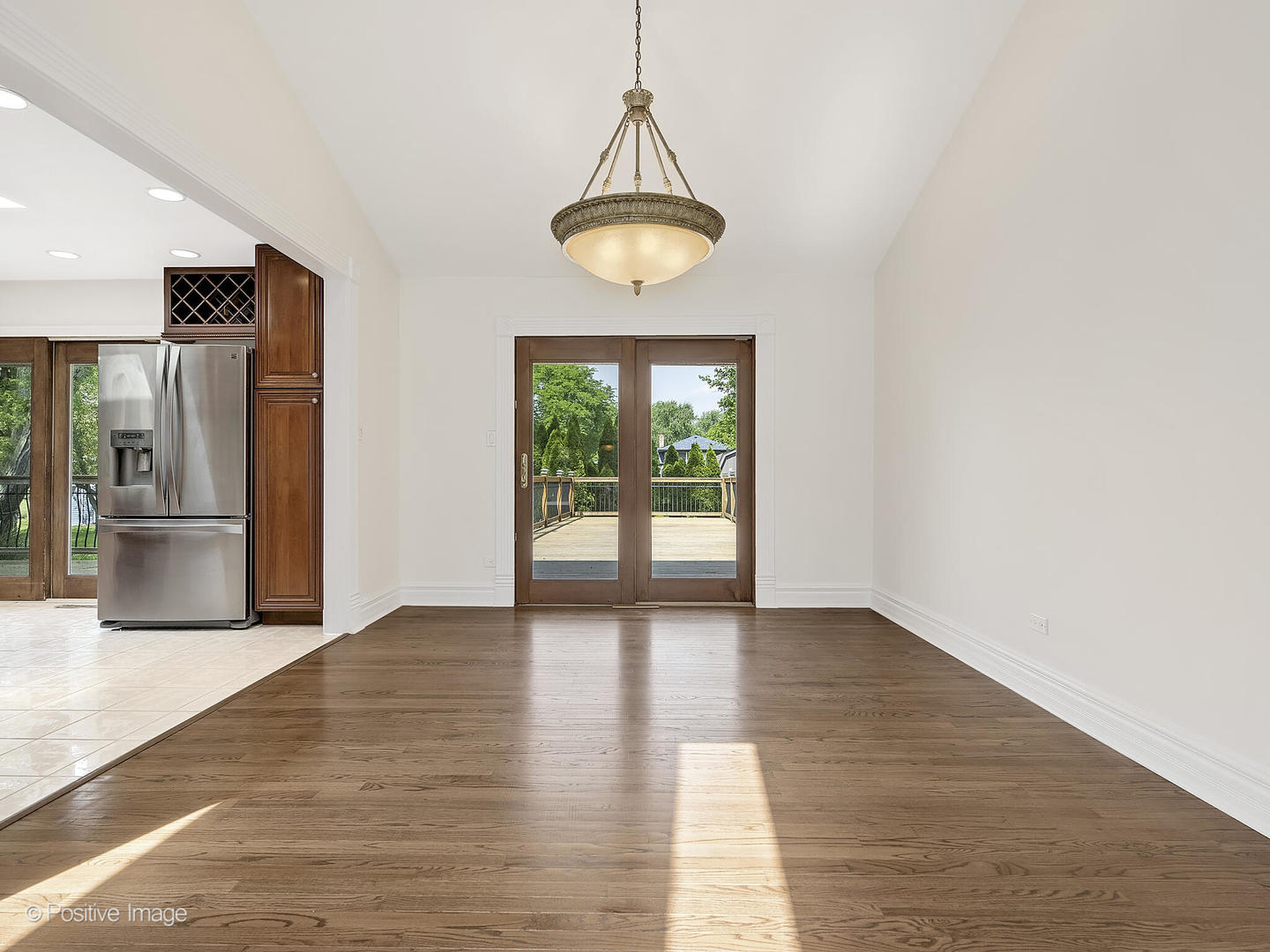 11S568 Book Road Naperville, IL 60564 - Photo 8 of 25 a view of an empty room with window and cabinet