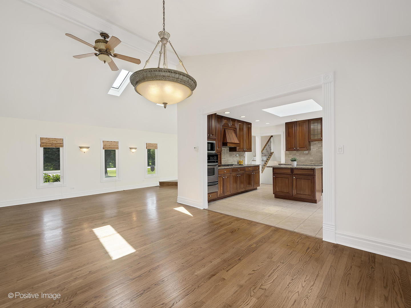 11S568 Book Road Naperville, IL 60564 - Photo 9 of 25 a view of a kitchen with wooden floor and a view of living room