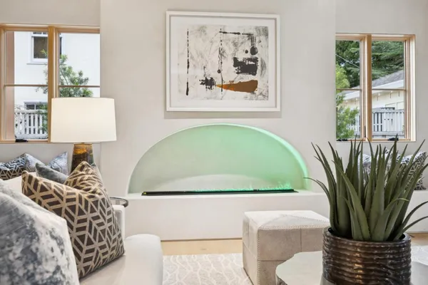a view of a bedroom with a couch and a potted plant