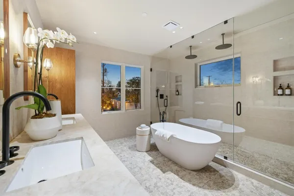 a spacious bathroom with a bathtub and sink