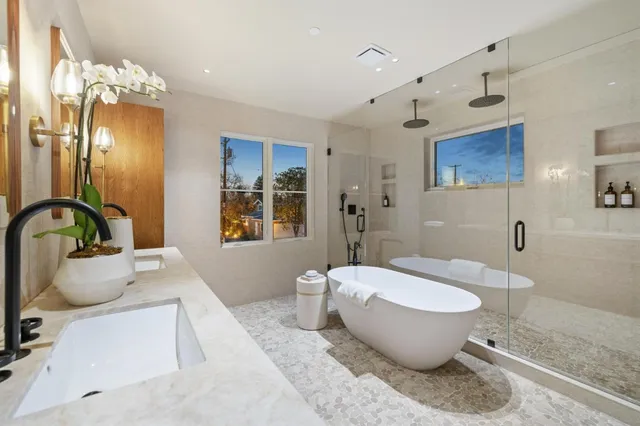 a spacious bathroom with a bathtub and sink