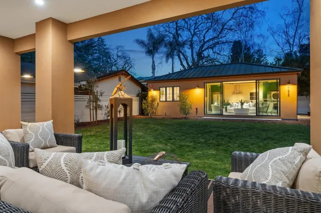 a living room with furniture and a garden