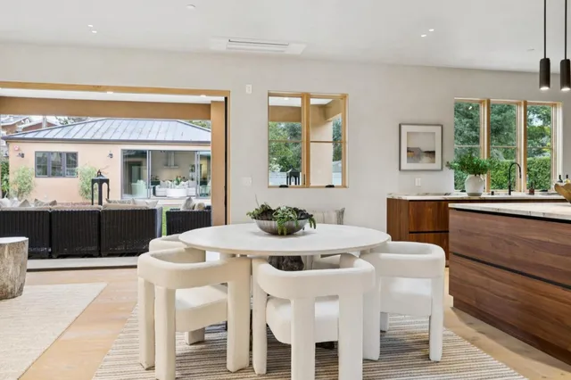 a view of a dining room with furniture window and outside view