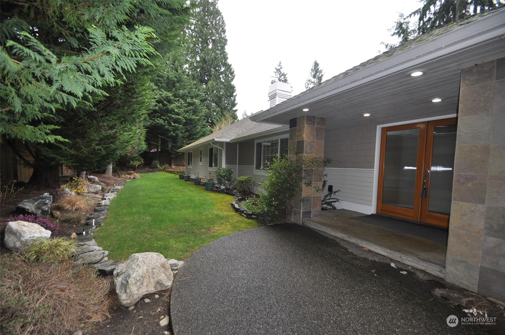 13003 Lake Kathleen Road Southeast Renton, WA 98059 - Photo 1 of 13 a view of a house with backyard and garden