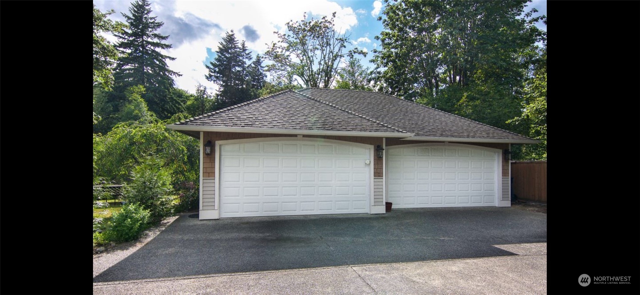 13003 Lake Kathleen Road Southeast Renton, WA 98059 - Photo 13 of 13 a small white house with a outdoor space