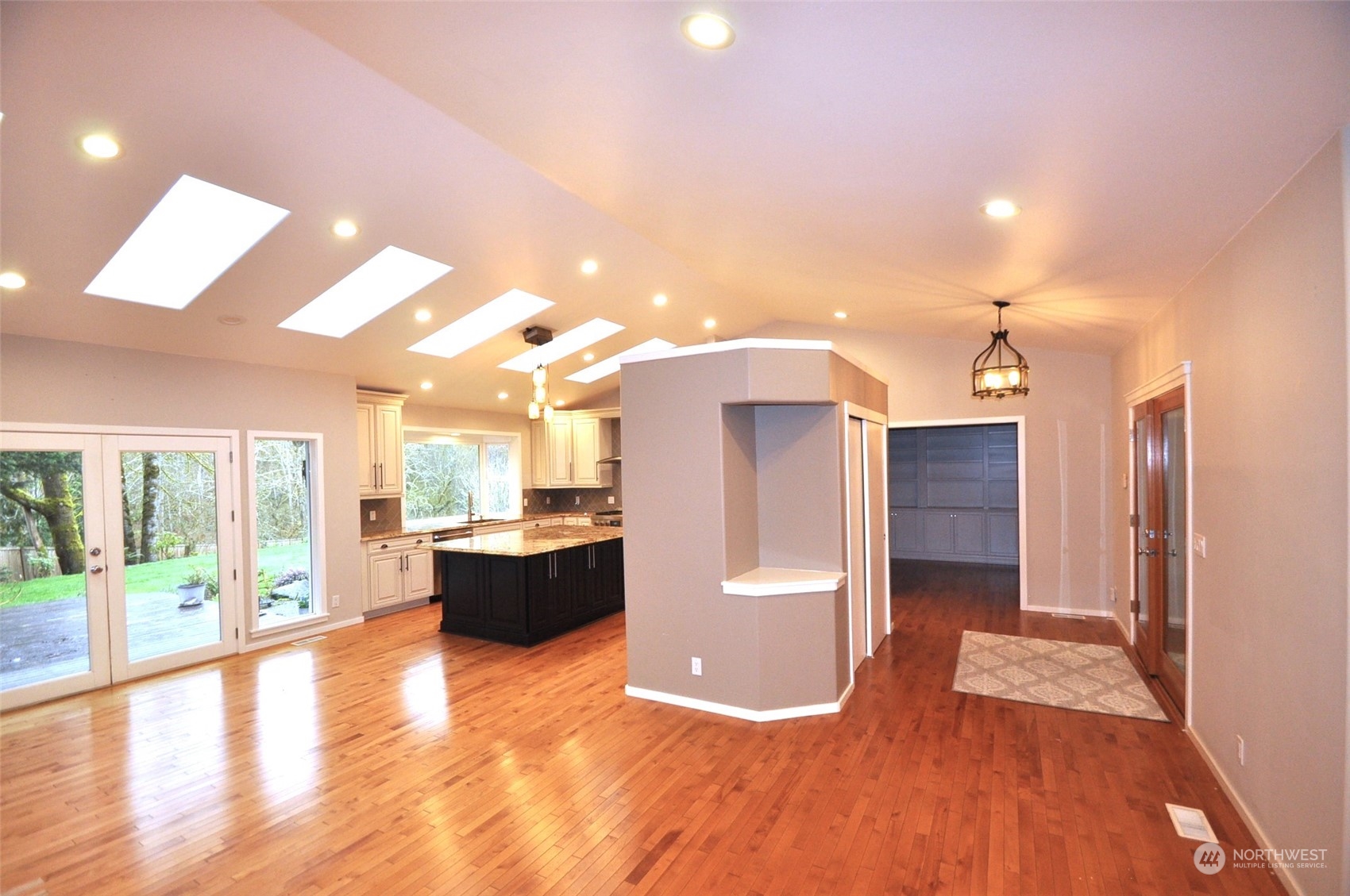 13003 Lake Kathleen Road Southeast Renton, WA 98059 - Photo 5 of 13 a view of a living room and a kitchen