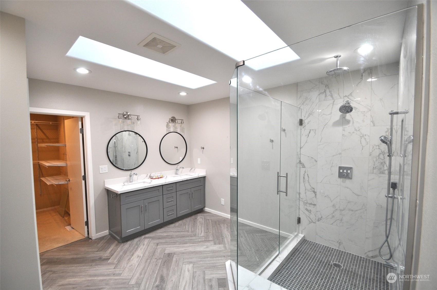 13003 Lake Kathleen Road Southeast Renton, WA 98059 - Photo 8 of 13 a bathroom with a shower a sink and a mirror