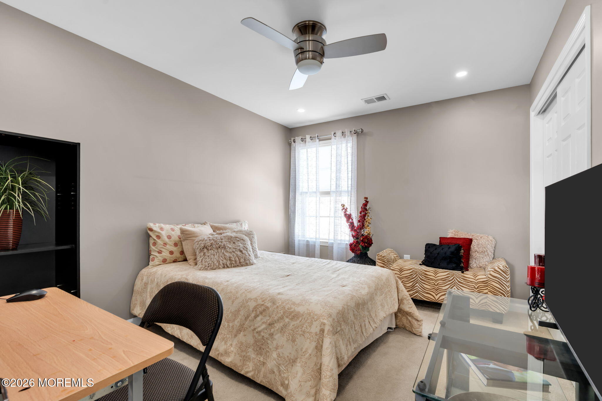 62 Santa Rosa Lane Tinton Falls, NJ 07753 - Photo 19 of 23 a bedroom with a bed and a flat screen tv