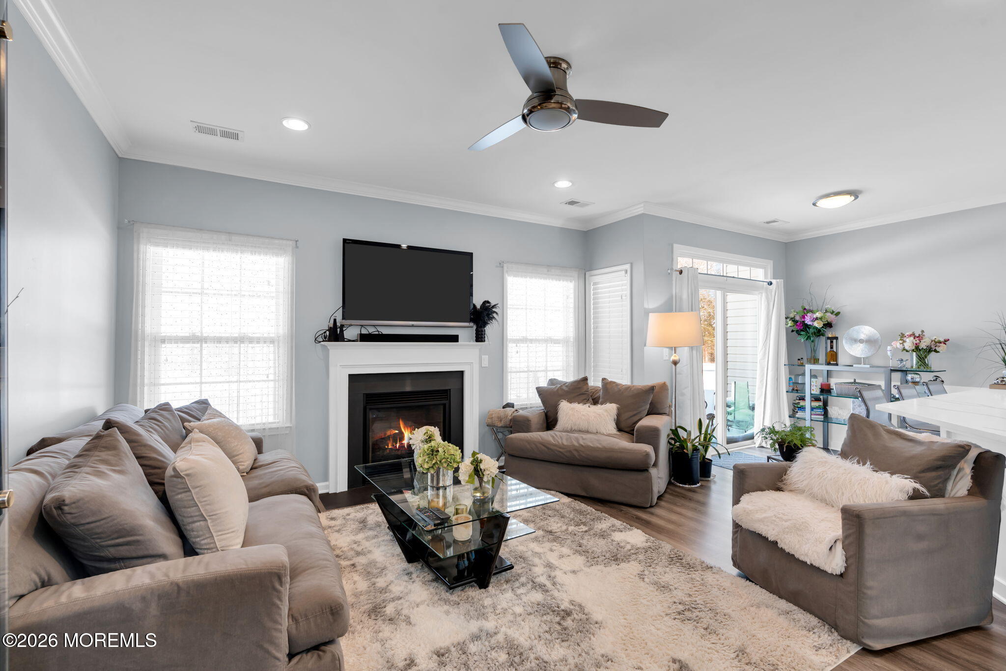 62 Santa Rosa Lane Tinton Falls, NJ 07753 - Photo 2 of 23 a living room with furniture a fireplace and a flat screen tv