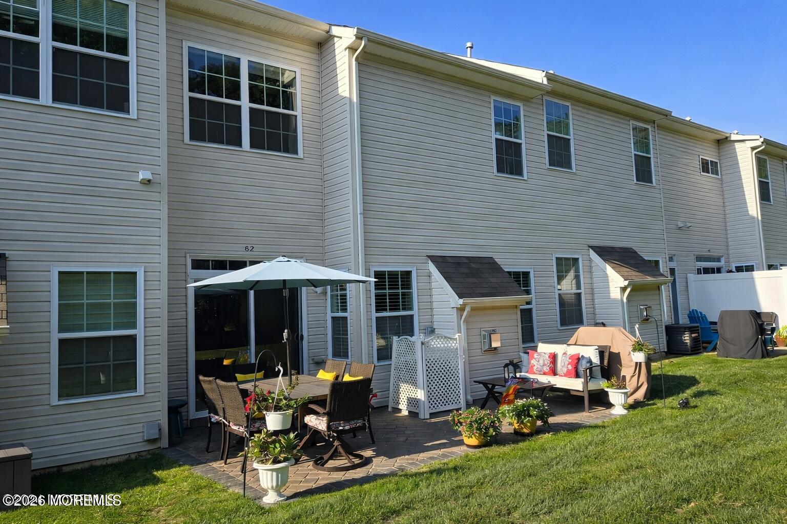 62 Santa Rosa Lane Tinton Falls, NJ 07753 - Photo 22 of 23 a backyard of a house with yard fire pit and outdoor seating