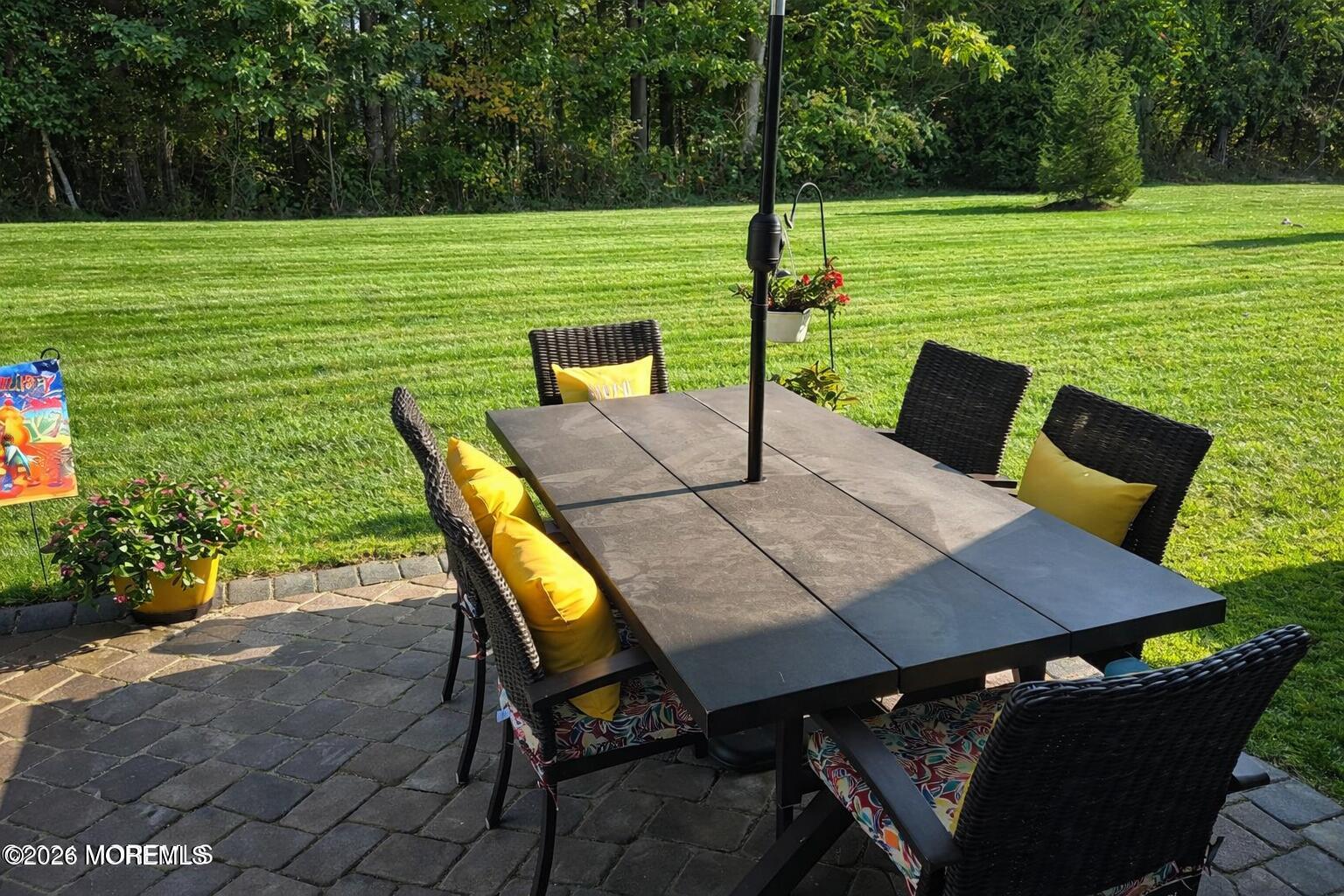 62 Santa Rosa Lane Tinton Falls, NJ 07753 - Photo 23 of 23 a view of a patio with a table chairs and a table