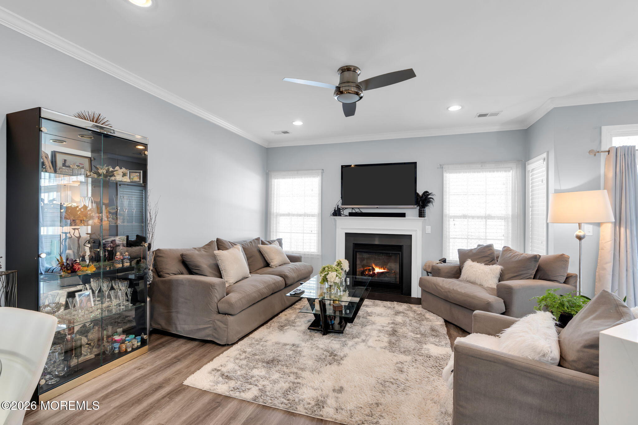 62 Santa Rosa Lane Tinton Falls, NJ 07753 - Photo 3 of 23 a living room with furniture a fireplace and a flat screen tv