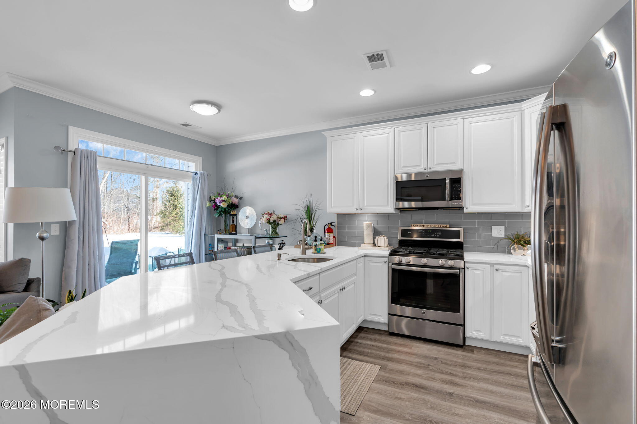 62 Santa Rosa Lane Tinton Falls, NJ 07753 - Photo 4 of 23 a kitchen with stainless steel appliances a stove refrigerator sink and microwave