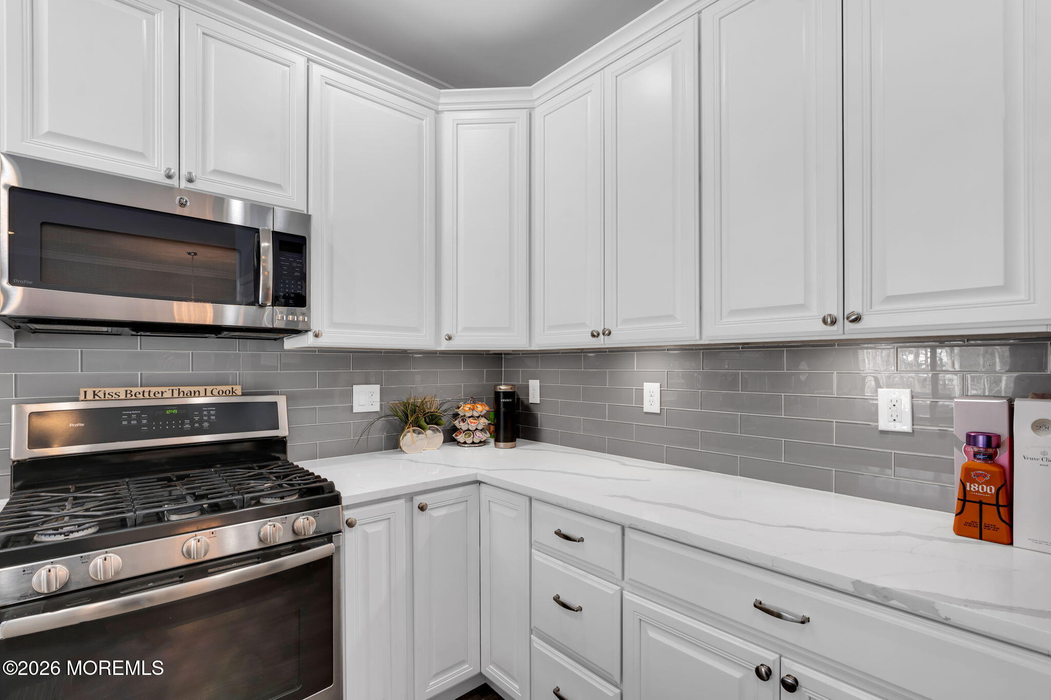 62 Santa Rosa Lane Tinton Falls, NJ 07753 - Photo 5 of 23 a kitchen with granite countertop white cabinets and stainless steel appliances
