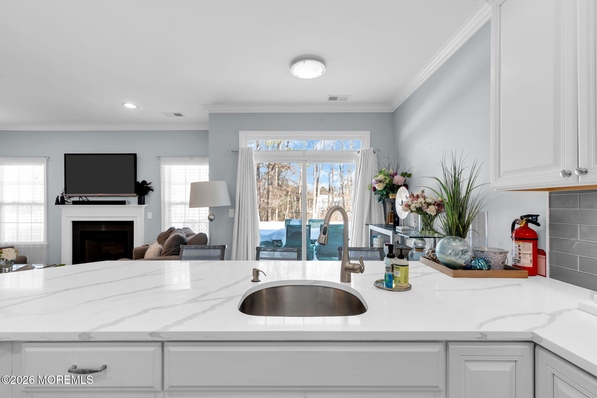 62 Santa Rosa Lane Tinton Falls, NJ 07753 - Photo 7 of 23 a kitchen with a sink and a refrigerator