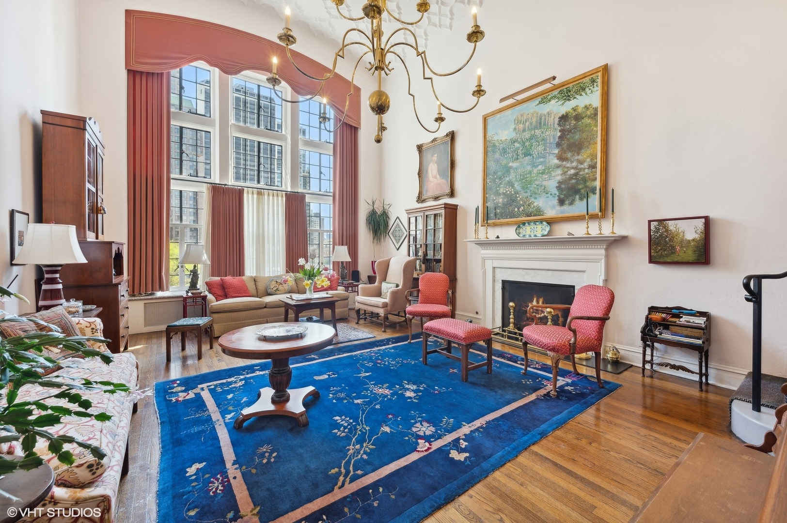 20 East Cedar Street, Unit 6E Chicago, IL 60611 - Photo 12 of 35 a living room with furniture a fireplace and a floor to ceiling window