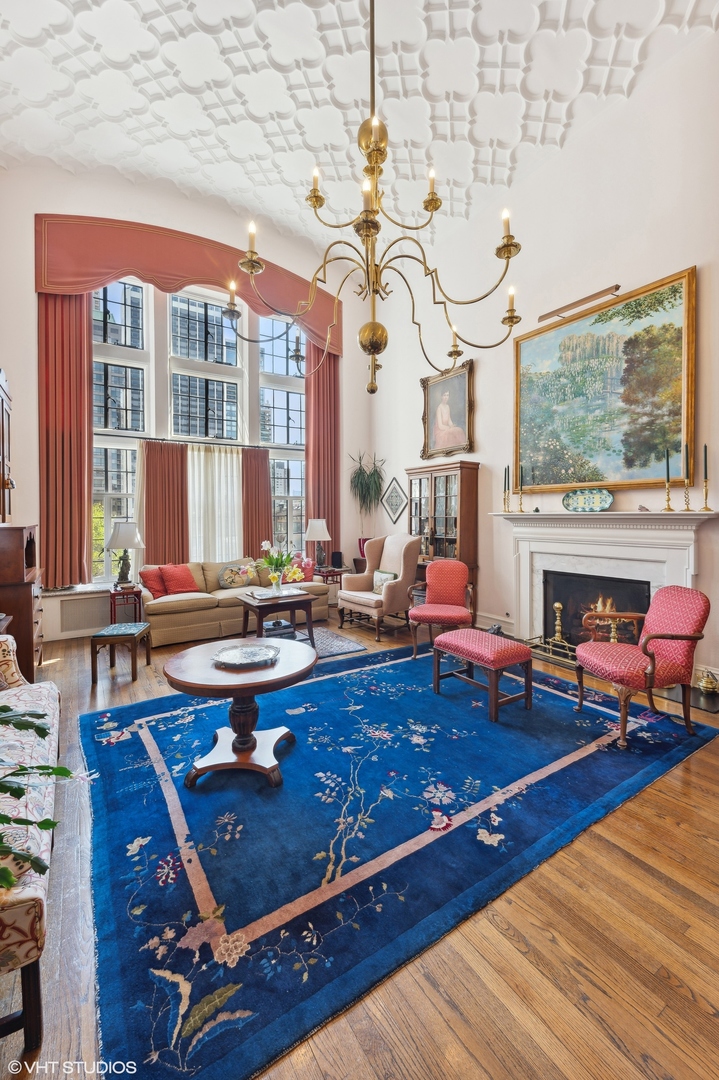 20 East Cedar Street, Unit 6E Chicago, IL 60611 - Photo 13 of 35 a living room with patio pool table and a fireplace