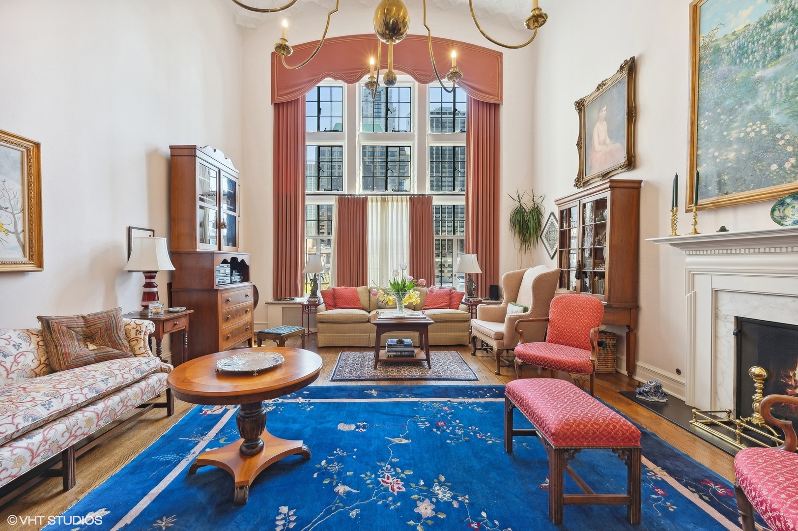 20 East Cedar Street, Unit 6E Chicago, IL 60611 - Photo 15 of 35 a living room with furniture a fireplace and large windows