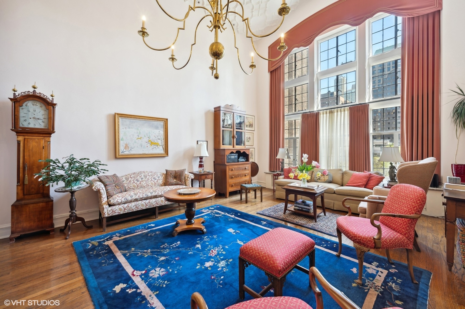 20 East Cedar Street, Unit 6E Chicago, IL 60611 - Photo 16 of 35 a living room with furniture a rug and a floor to ceiling window