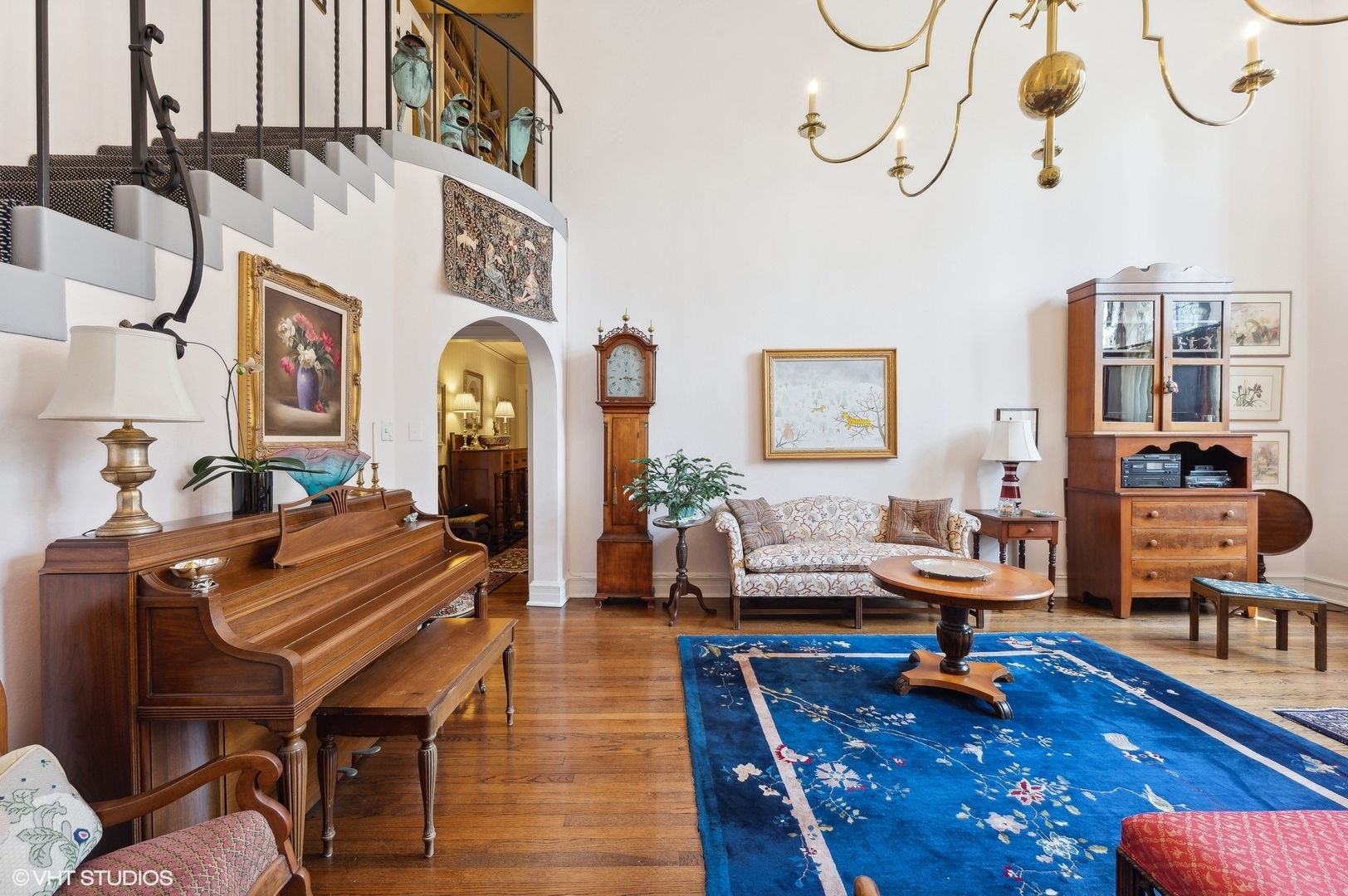 20 East Cedar Street, Unit 6E Chicago, IL 60611 - Photo 18 of 35 a living room with furniture a rug and a chandelier