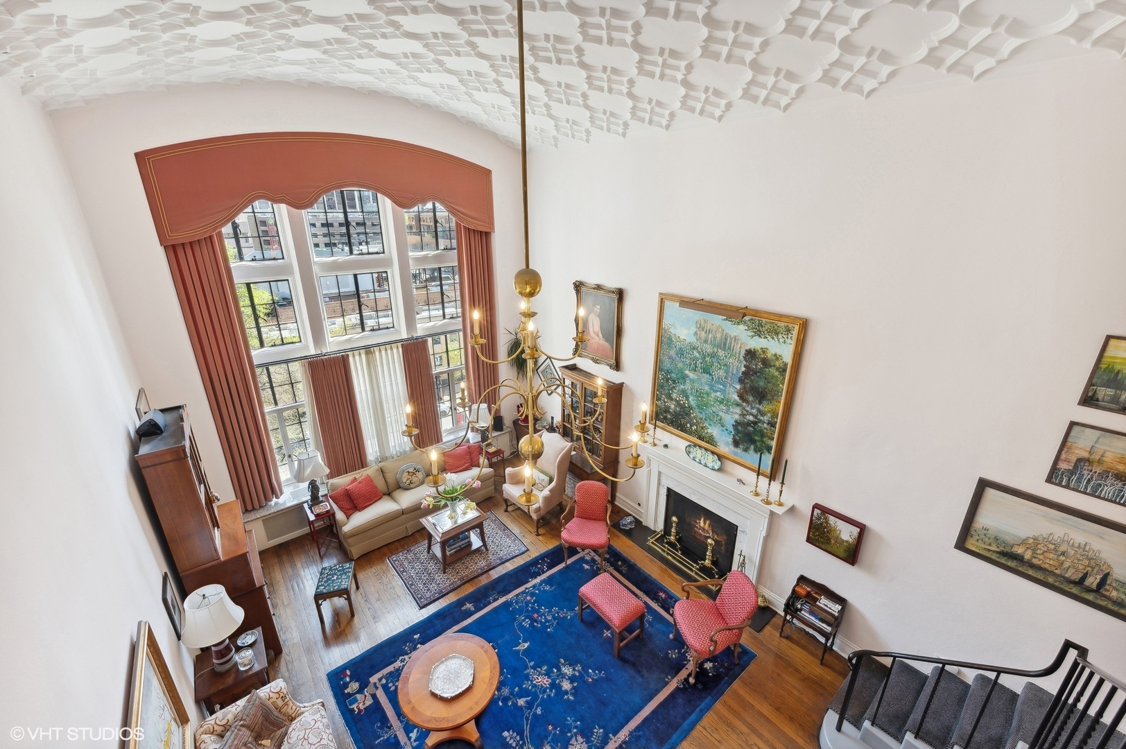 20 East Cedar Street, Unit 6E Chicago, IL 60611 - Photo 20 of 35 a living room with furniture a fireplace and a floor to ceiling window
