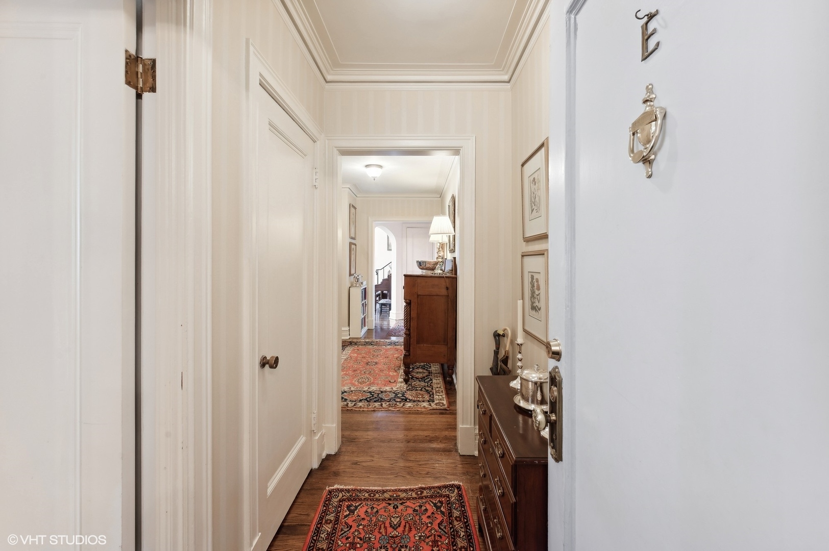 20 East Cedar Street, Unit 6E Chicago, IL 60611 - Photo 2 of 35 a view of a hallway with a livingroom and a bathroom