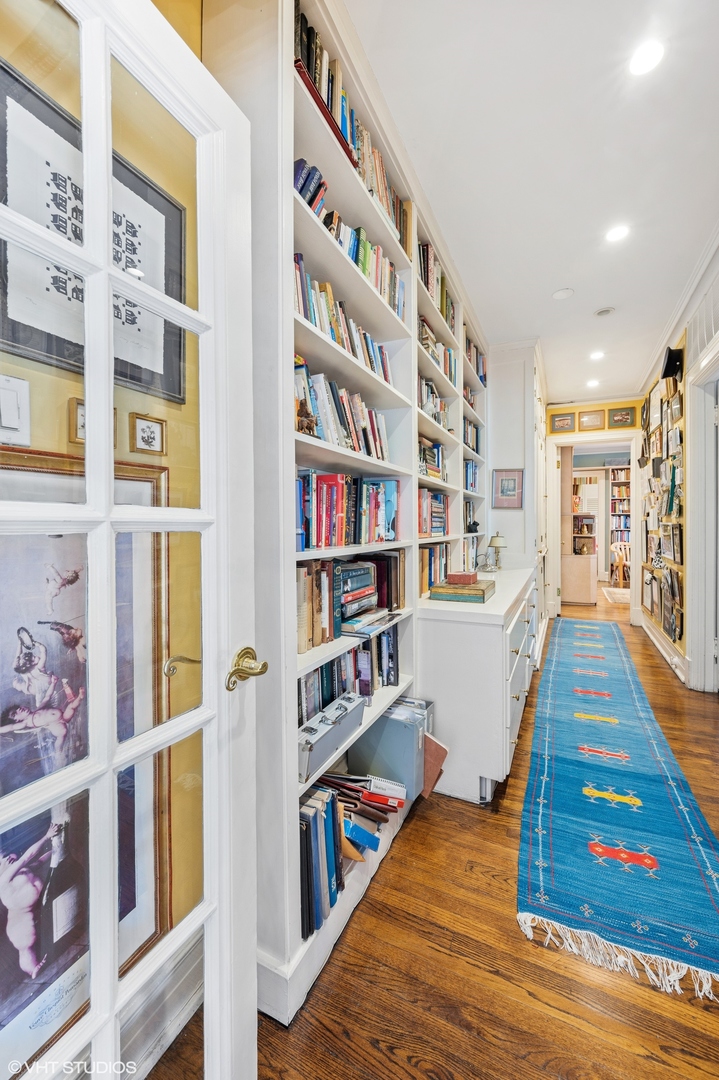 20 East Cedar Street, Unit 6E Chicago, IL 60611 - Photo 22 of 35 a room with lots of furniture and wooden floor
