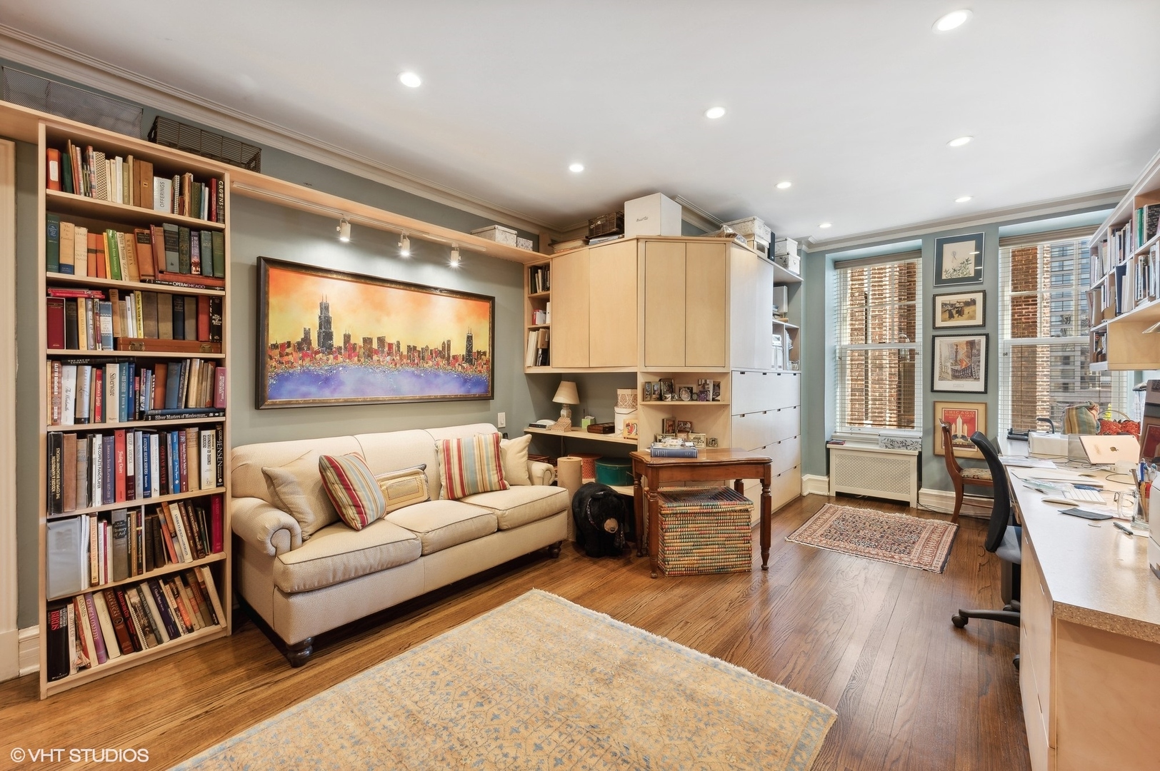 20 East Cedar Street, Unit 6E Chicago, IL 60611 - Photo 26 of 35 a living room with furniture and a book shelf