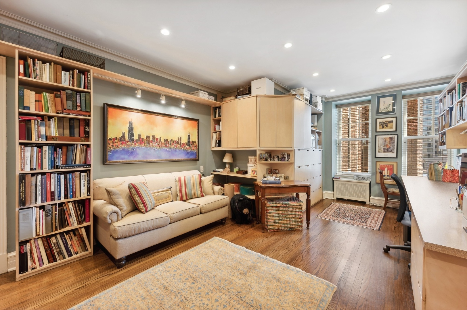 20 East Cedar Street, Unit 6E Chicago, IL 60611 - Photo 27 of 35 a living room with furniture and a book shelf