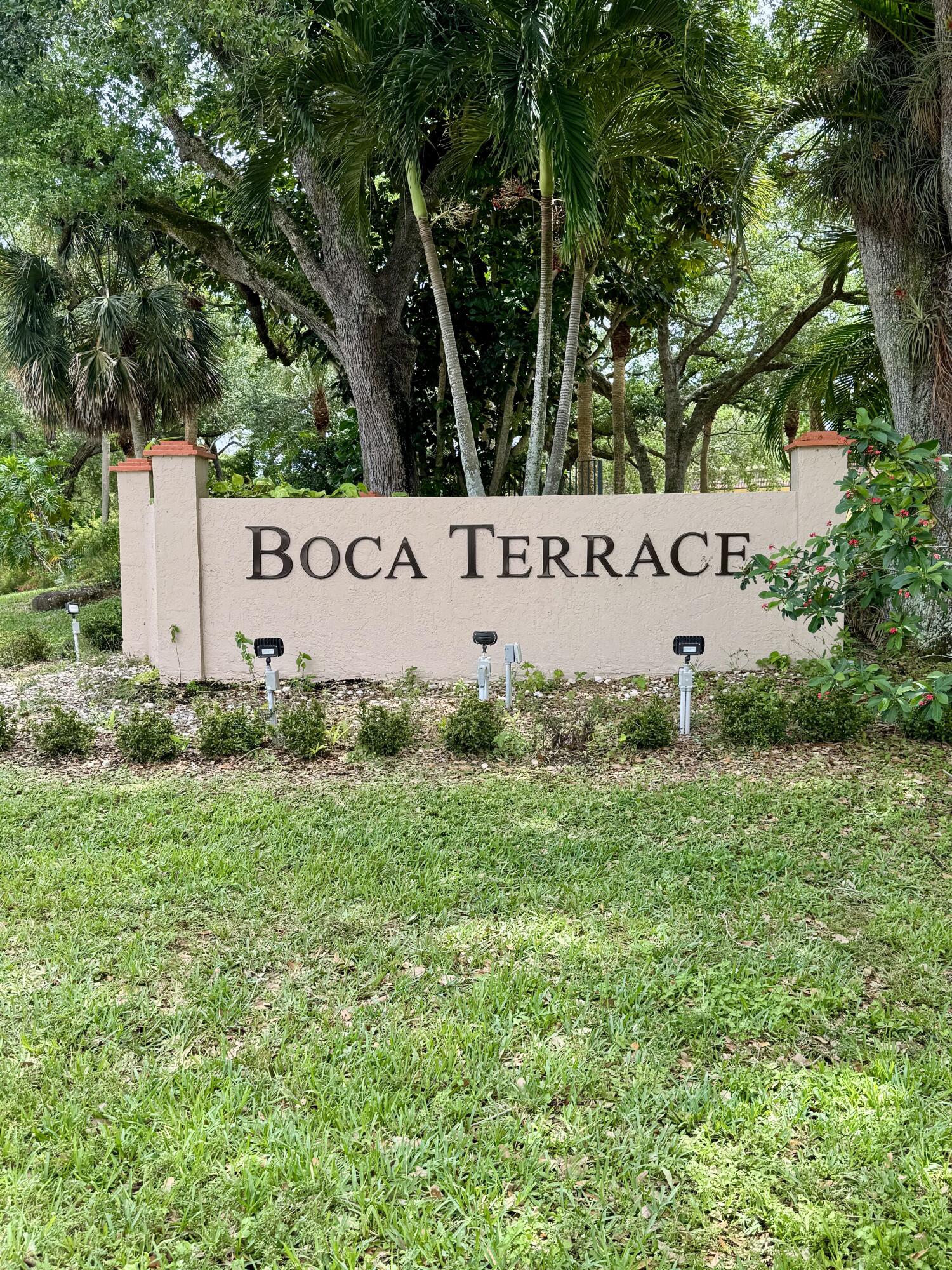 912 Southwest 9th St Circle, Unit 101 Boca Raton, FL 33486 - Photo 1 of 25 a sign that is sitting in front of a tree