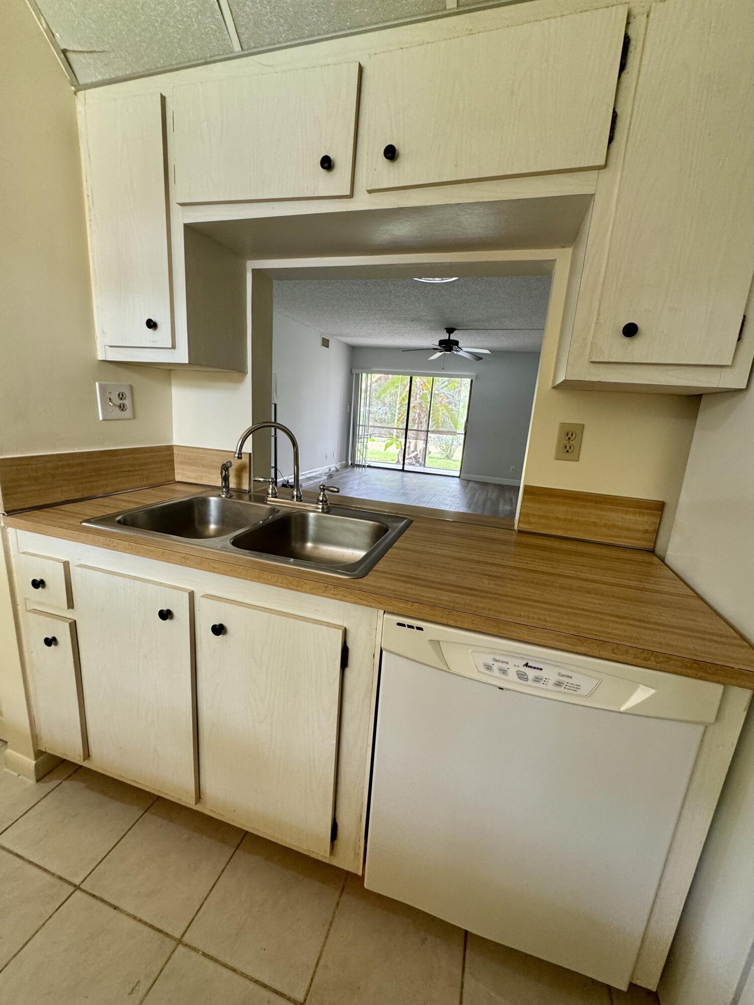 912 Southwest 9th St Circle, Unit 101 Boca Raton, FL 33486 - Photo 11 of 25 a bathroom with a sink and a mirror