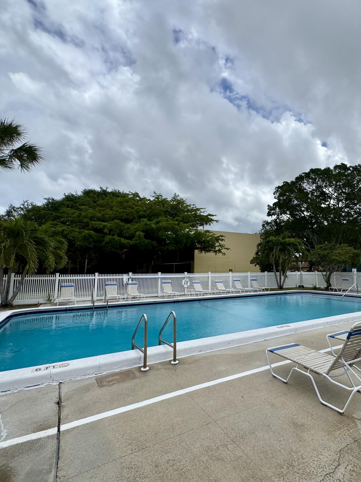 912 Southwest 9th St Circle, Unit 101 Boca Raton, FL 33486 - Photo 24 of 25 a view of a tennis court