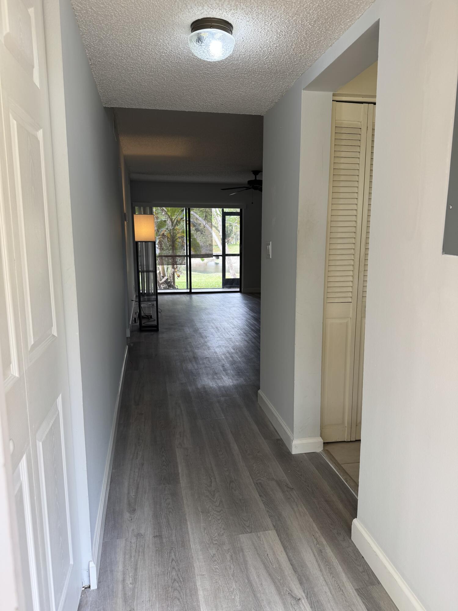 912 Southwest 9th St Circle, Unit 101 Boca Raton, FL 33486 - Photo 3 of 25 an entryway of a house with wooden floor