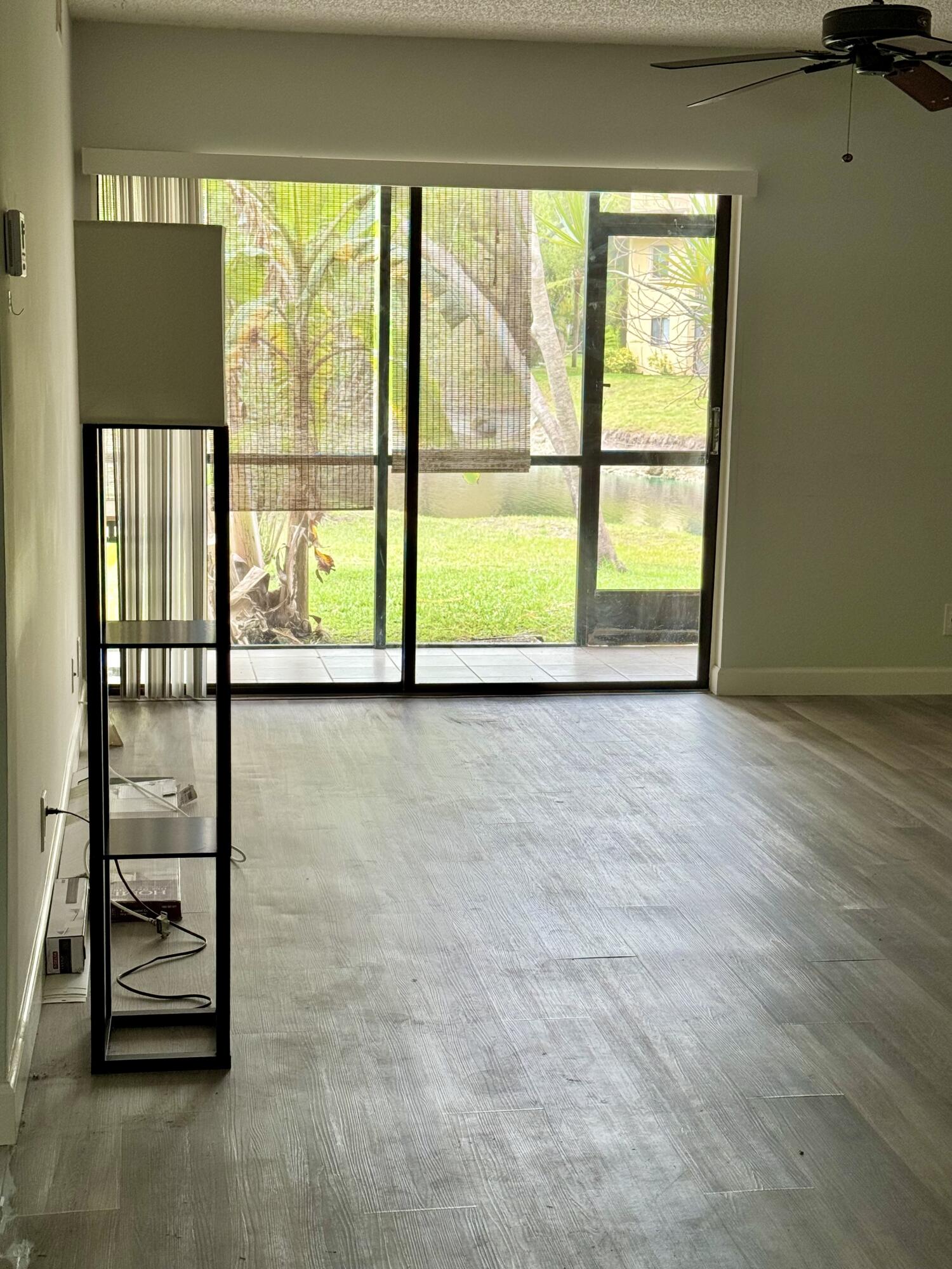 912 Southwest 9th St Circle, Unit 101 Boca Raton, FL 33486 - Photo 6 of 25 a view of an empty room with a window