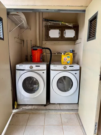 a utility room with dryer and washer