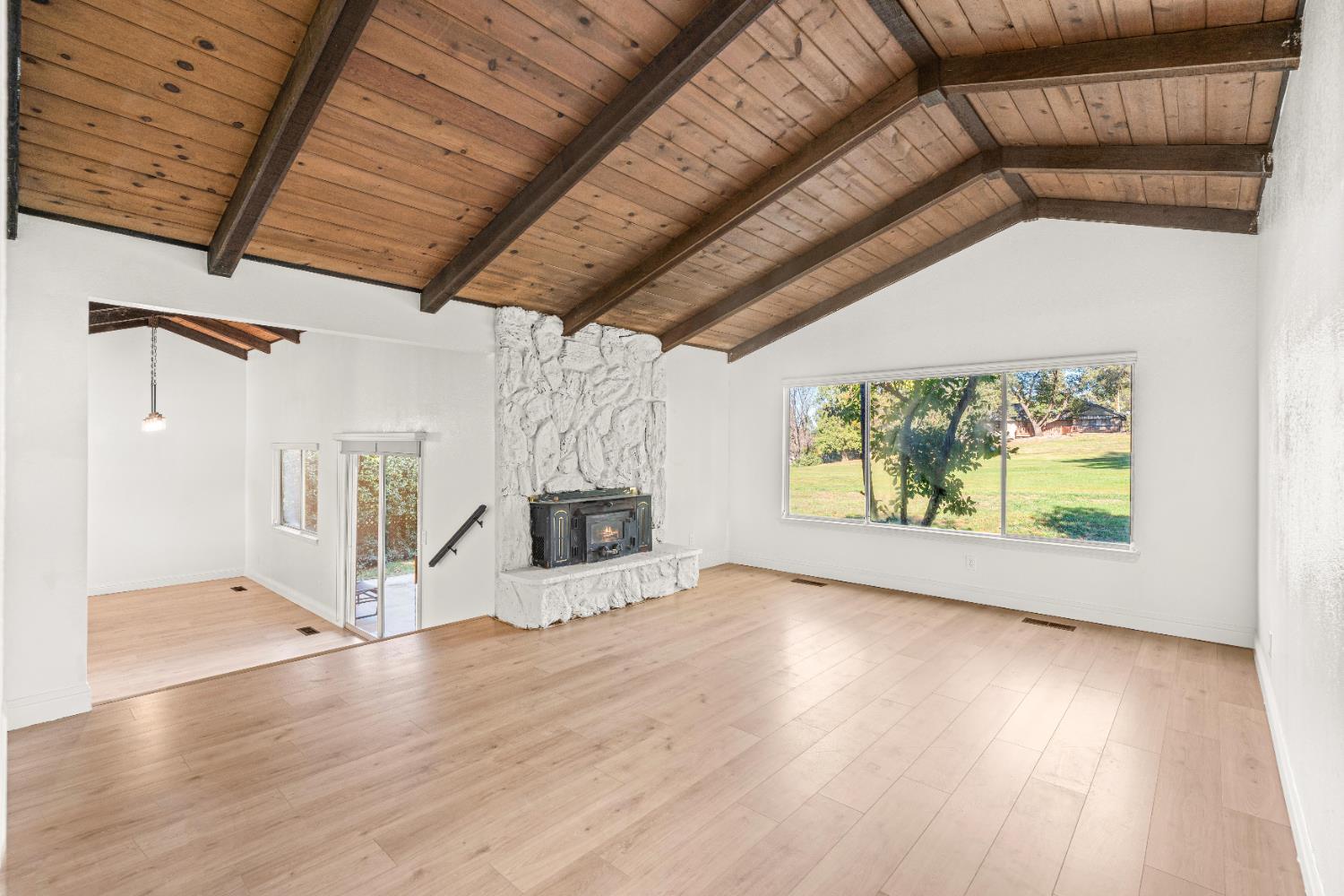 24626 Oro Valley Road Auburn, CA 95602 - Photo 20 of 54 a view of a room with wooden floors and outer view